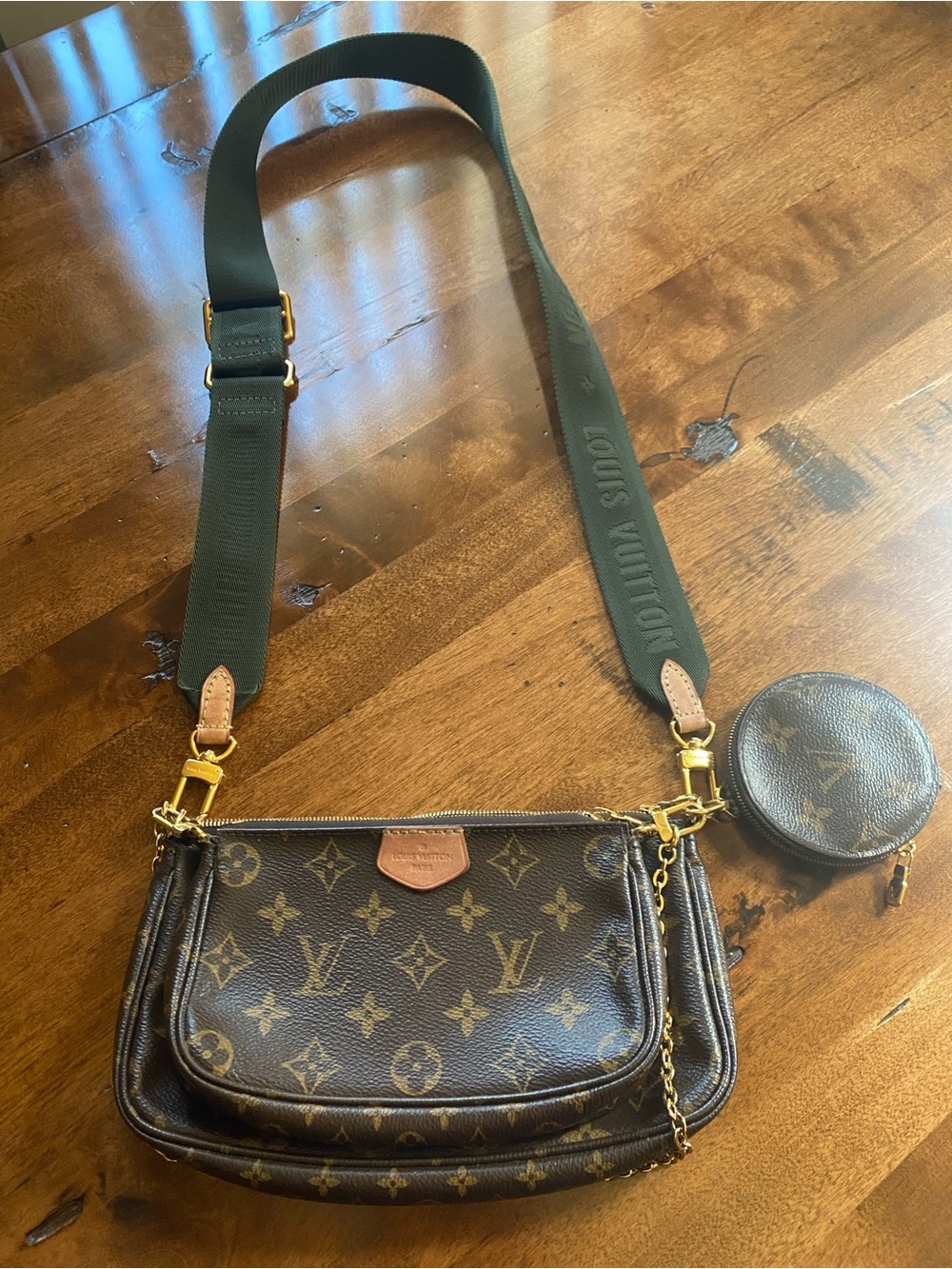 Louis Vuitton Monogram Multi Pochette Crossbody in Brown with Green Strap.